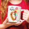 Auf dem Bild ist das Produkt: Geschenkidee Tasse aus Keramik oder Kunststoff bedruckt Igel Mädchen Schultüte personalisiert mit Wunschnamen und Datum zum Preis von €18.90 abgebildet.