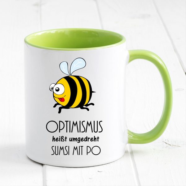 Auf dem Bild ist das Produkt: Tasse Biene Optimismus Sumsi mit Po Tasse Becher Geschenk Geburtstag zum Preis von €17.90 abgebildet.