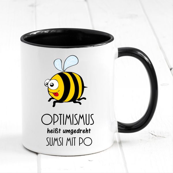 Auf dem Bild ist das Produkt: Tasse Biene Optimismus Sumsi mit Po Tasse Becher Geschenk Geburtstag zum Preis von €17.90 abgebildet.