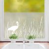 Auf dem Bild ist das Produkt: Sichtschutzfolie Storch und Gräser Wildblumen florale Fensterfolie Fensterdeko Milchglasfolie Folie Fenster zum Preis von €24.9 abgebildet.