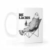 Auf dem Bild ist das Produkt: Tasse bedruckt Lachs mit Bierflasche im Anglerstuhl Relax Relachs Kaffeetasse Kaffeebecher zum Preis von €15.9 abgebildet.