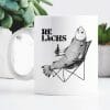 Auf dem Bild ist das Produkt: Tasse bedruckt Lachs mit Bierflasche im Anglerstuhl Relax Relachs Kaffeetasse Kaffeebecher zum Preis von €15.9 abgebildet.