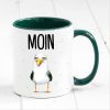 Auf dem Bild ist das Produkt: Bedruckte Keramiktasse Geschenkidee maritime Tasse Moin mit Möwe Geburtstagsgeschenk zum Preis von €17.9 abgebildet.