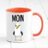 Auf dem Bild ist das Produkt: Bedruckte Keramiktasse Geschenkidee maritime Tasse Moin mit Möwe Geburtstagsgeschenk zum Preis von €17.9 abgebildet.