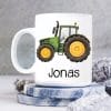 Auf dem Bild ist das Produkt: Tasse bedruckt mit einem grünen Traktor Trecker, Geschenk Geburtstag für Jungen zum Preis von €16.9 abgebildet.