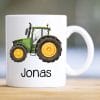 Auf dem Bild ist das Produkt: Tasse bedruckt mit einem grünen Traktor Trecker, Geschenk Geburtstag für Jungen zum Preis von €16.9 abgebildet.