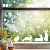 Auf dem Bild ist das Produkt: Fensteraufkleber Hasen mit Ostereiern und Schmetterlingen WIEDERVERWENDBAR zum Preis von €12.90 abgebildet.