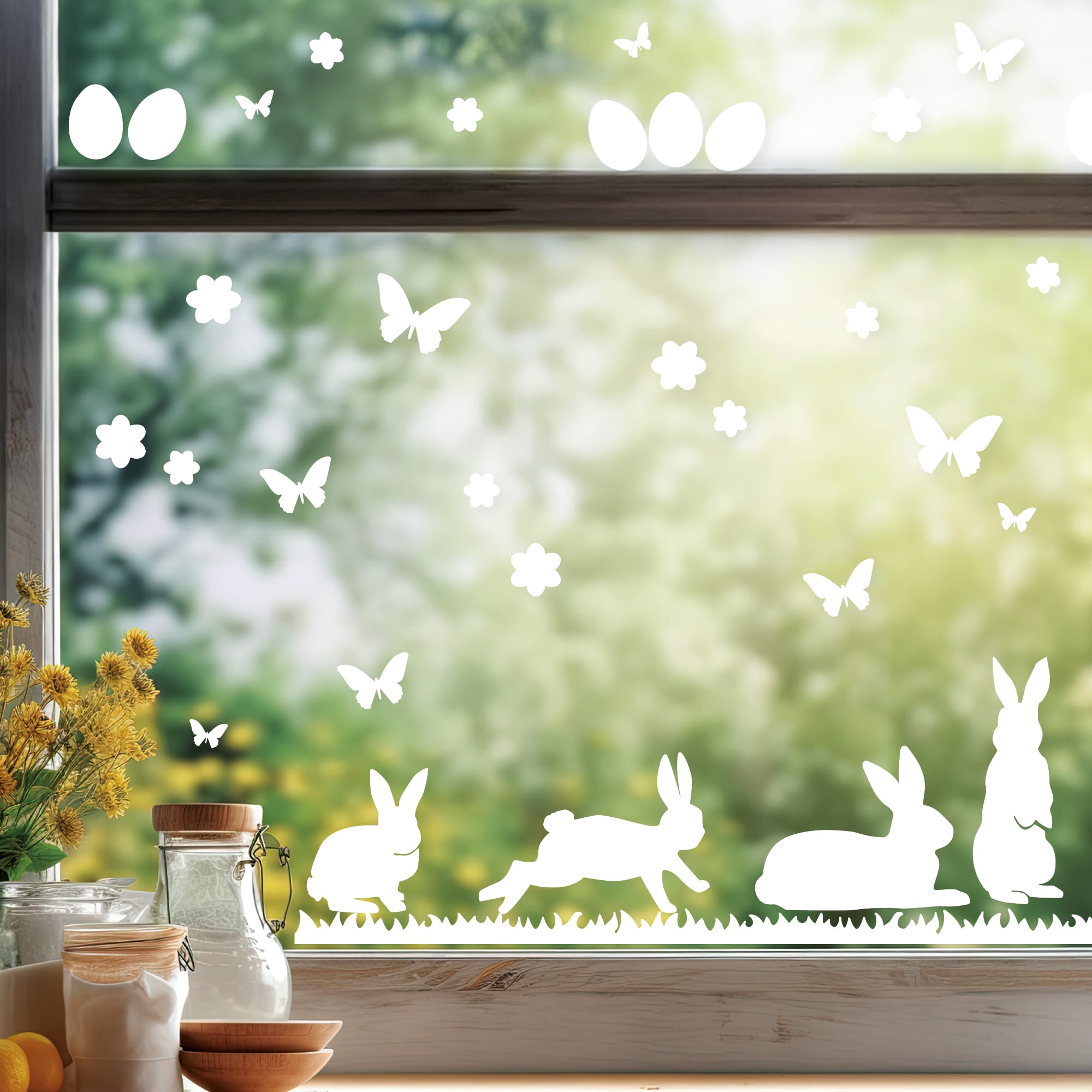 Auf dem Bild ist das Produkt: Fensteraufkleber Hasen mit Ostereiern und Schmetterlingen WIEDERVERWENDBAR zum Preis von €12.90 abgebildet.