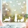 Auf dem Bild ist das Produkt: Fensteraufkleber Hasen mit Ostereiern und Schmetterlingen WIEDERVERWENDBAR zum Preis von €12.90 abgebildet.