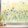 Auf dem Bild ist das Produkt: Fensterbild Kornblumenwiese wiederverwendbar blau pastell Blumenwiese mit Schmetterlingen Hummeln Fensterdekoration zum Preis von €13.9 abgebildet.