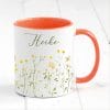 Auf dem Bild ist das Produkt: Tasse Wildblumen personalisiert farbig mit Wildblumen und dem Wunschnamen Natur Naturliebhaber zum Preis von €17.90 abgebildet.