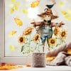 Auf dem Bild ist das Produkt: Fensterbild Herbst Vogelscheuche mit Sonnenblumen und Blättern Rabe herbstlicher Fensteraufkleber Fensterdeko Eingang Küche Erntedankfest zum Preis von €13.9 abgebildet.
