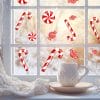 Auf dem Bild ist das Produkt: Fensterbild Weihnachten Zuckerstangen Set Bonbons rot weiß Fensteraufkleber Weihnachtsdekoration wiederverwendbar zum Preis von €13.9 abgebildet.