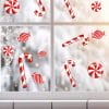 Auf dem Bild ist das Produkt: Fensterbild Weihnachten Zuckerstangen Set Bonbons rot weiß Fensteraufkleber Weihnachtsdekoration wiederverwendbar zum Preis von €13.9 abgebildet.