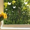 Auf dem Bild ist das Produkt: Fensterbild Wildblumen Frühling zarte Blumen Wildblumenfeld Blumenwiese Fensterdeko Wiederverwendbar Fensterfolie Schmetterlinge zum Preis von €13.90 abgebildet.